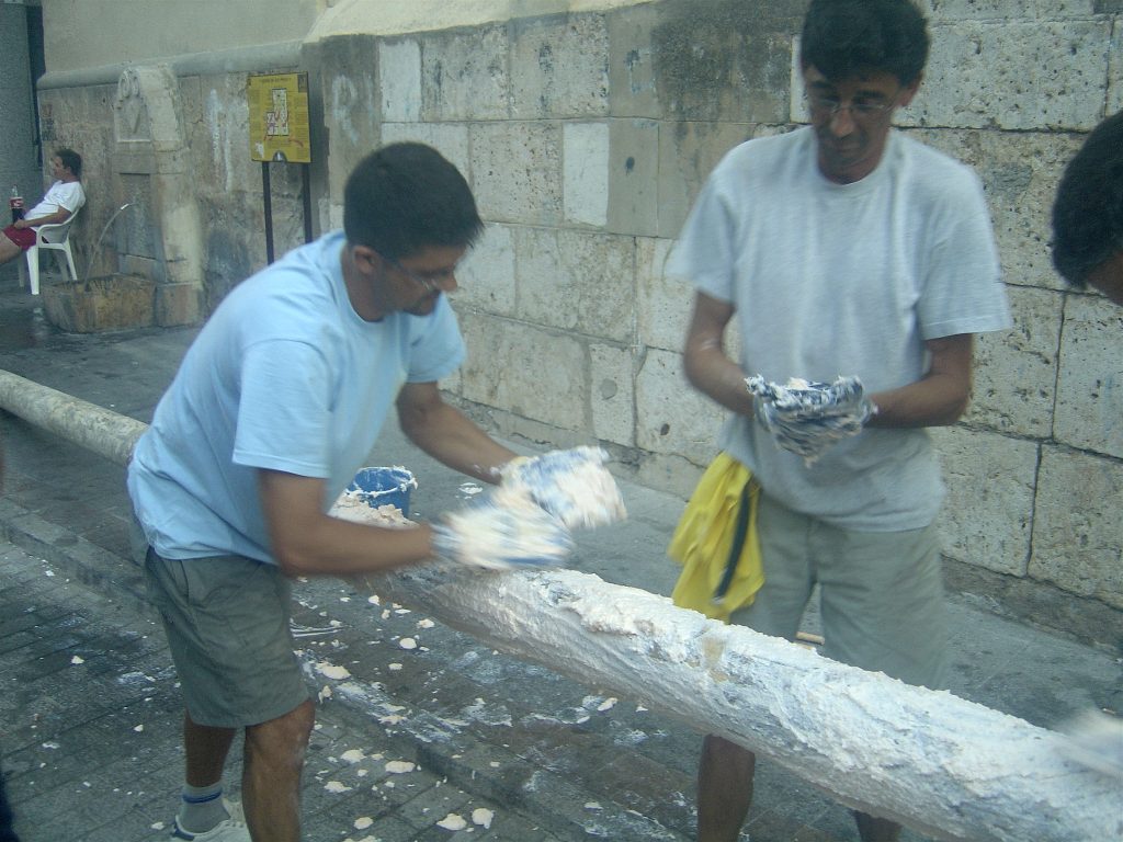 Two Men Preparing Greasy Pole for La Tomatina Festival.