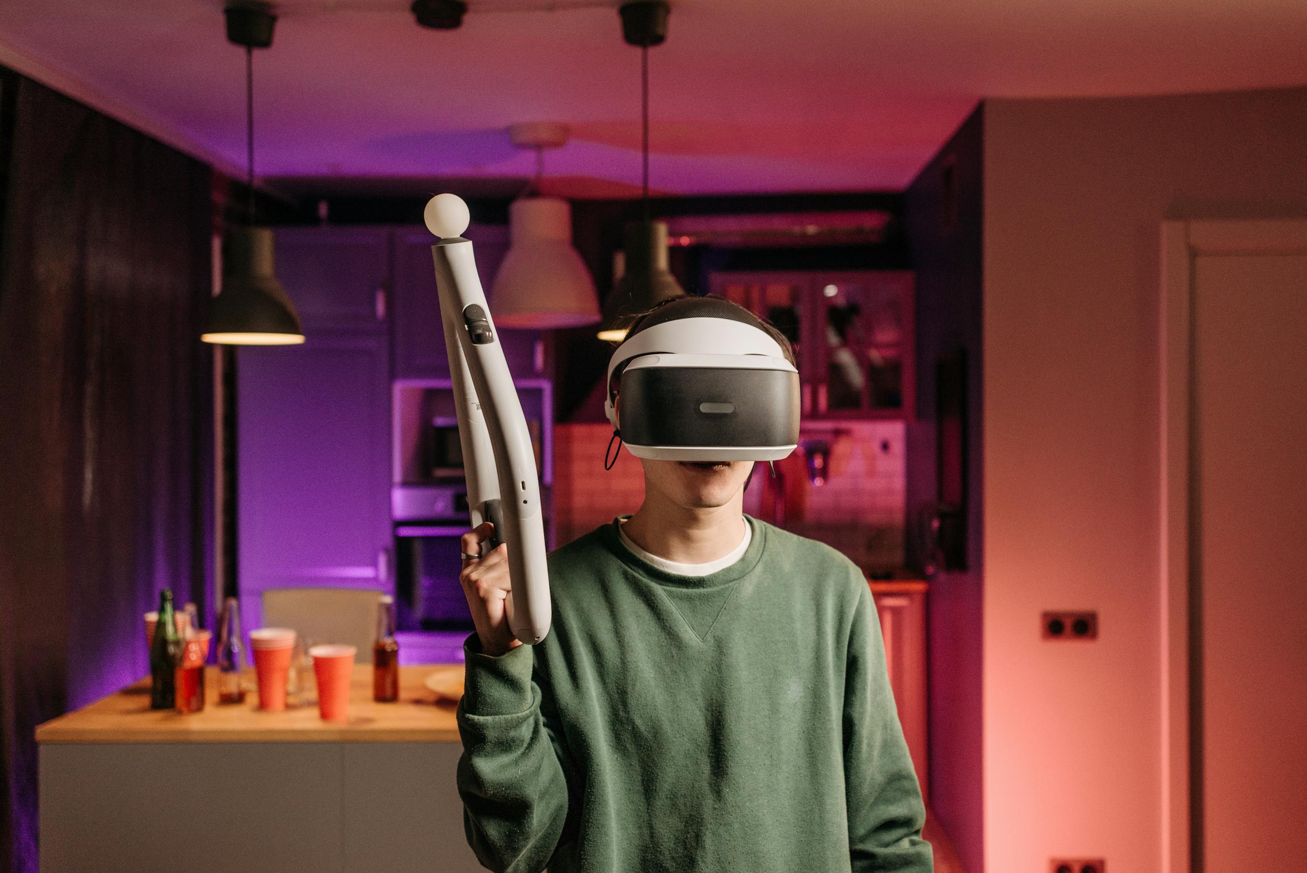 A young adult using a VR headset and controller in a modern room for gaming.