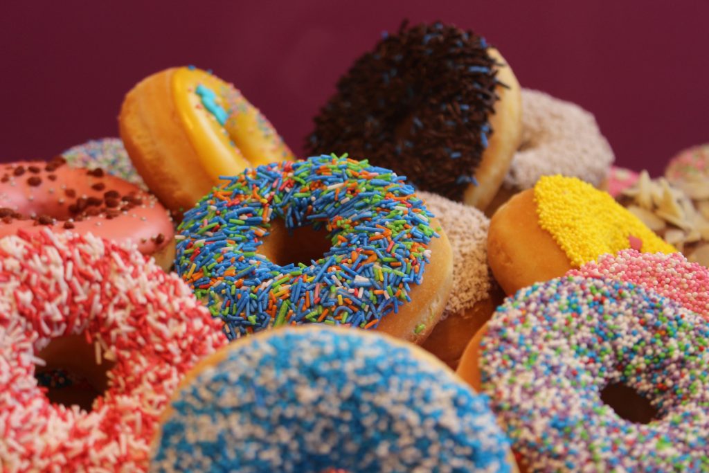 Various donuts with multicolored sprinkles