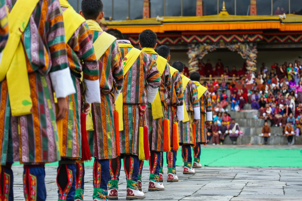 A group of male dancers get ready for a traditional item during Thimphu Tshechu festival in Bhutan.