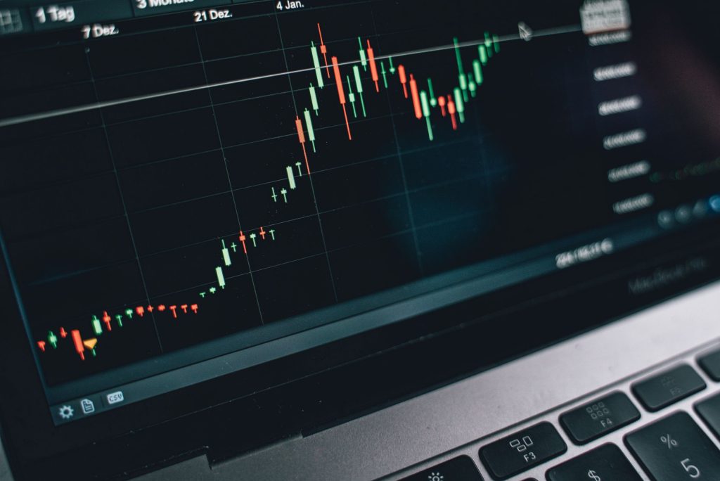 Close-up of a computer screen displaying cryptocurrency market trends and data.